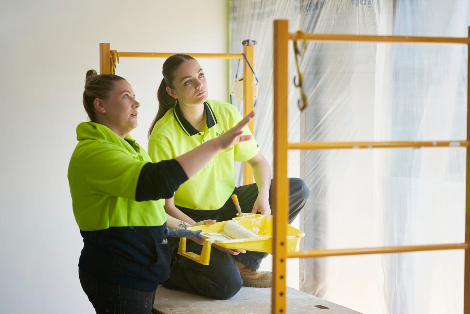 female builder and female apprentice