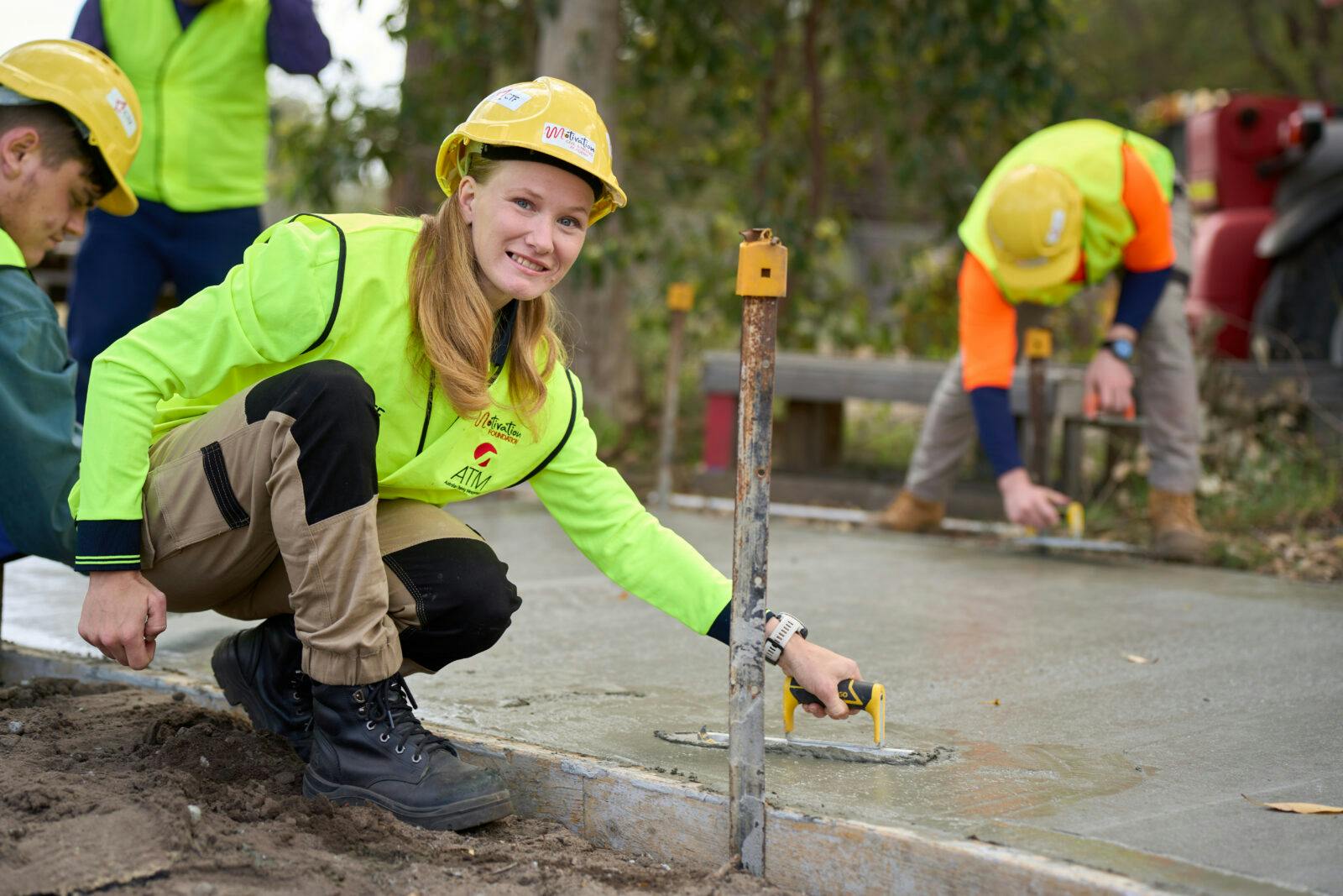 Female trade worker doing concreting work